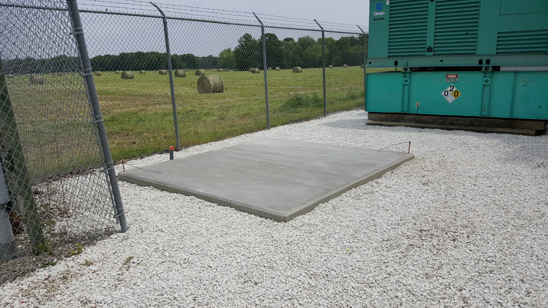 Generator pad with gravel compound and fencing