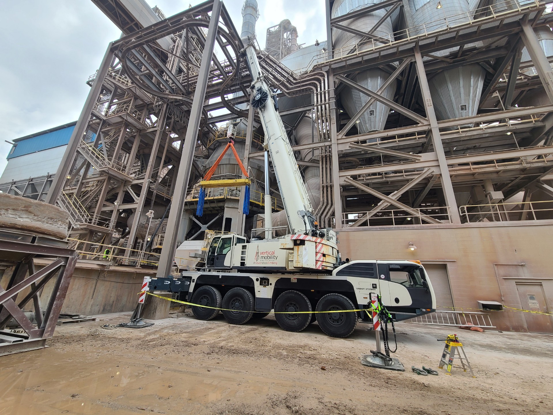 VMC 120-ton crane performing heavy lift at industrial concrete plant