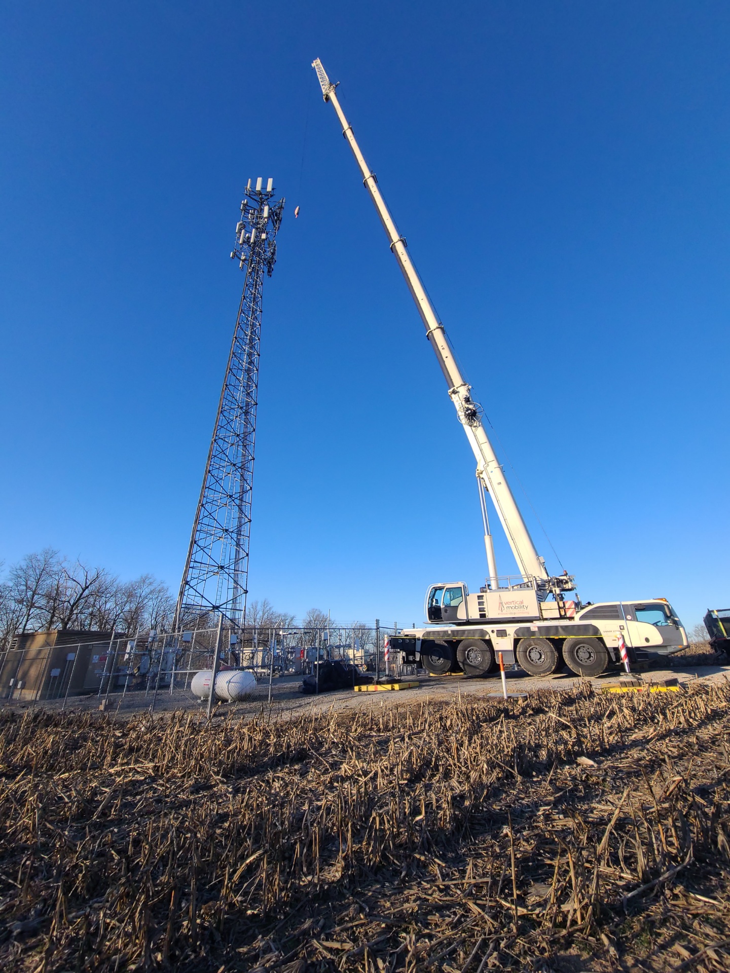 VMC all-terrain crane at rural cell tower site