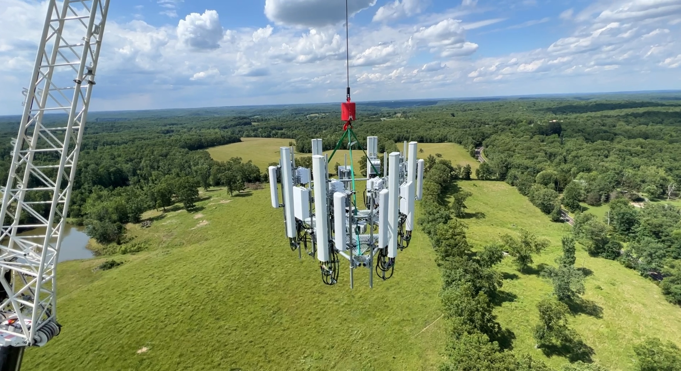 Crane lifting antenna array at height